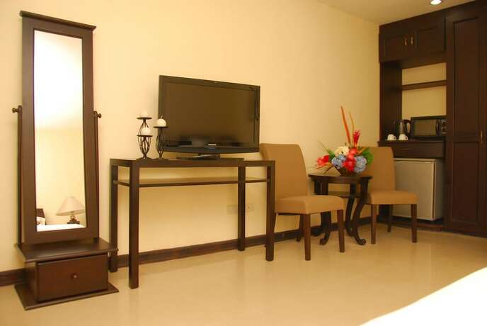 Imagen de la habitación del Hotel The Suites At Calle Nueva. Foto 19