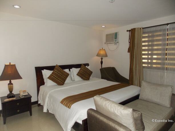 Imagen de la habitación del Hotel The Suites At Calle Nueva. Foto 21