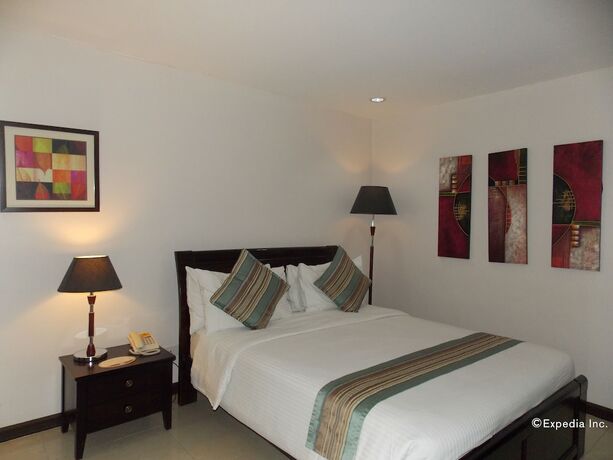 Imagen de la habitación del Hotel The Suites At Calle Nueva. Foto 22