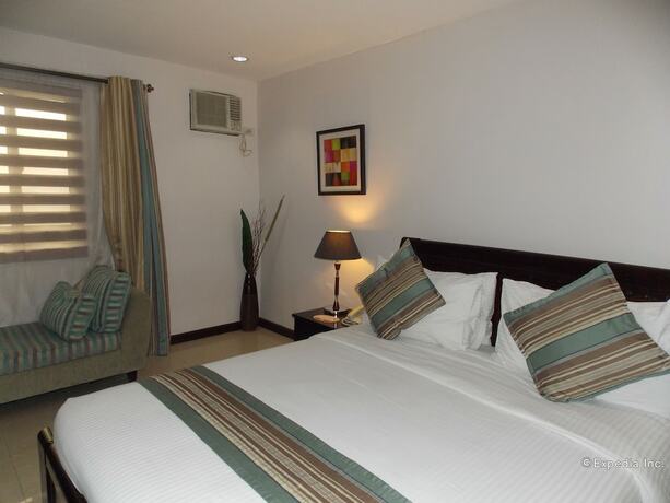Imagen de la habitación del Hotel The Suites At Calle Nueva. Foto 23