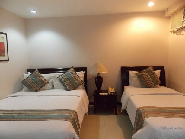 Imagen de la habitación del Hotel The Suites At Calle Nueva. Foto 24
