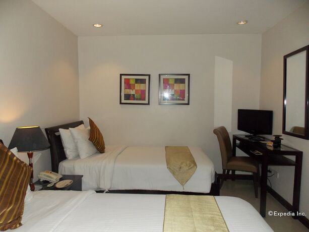 Imagen de la habitación del Hotel The Suites At Calle Nueva. Foto 25