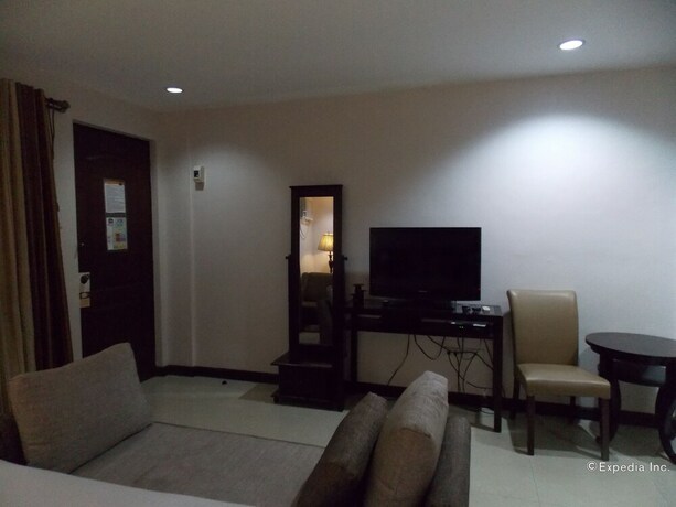 Imagen de la habitación del Hotel The Suites At Calle Nueva. Foto 26