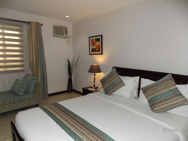 Imagen de la habitación del Hotel The Suites At Calle Nueva. Foto 27