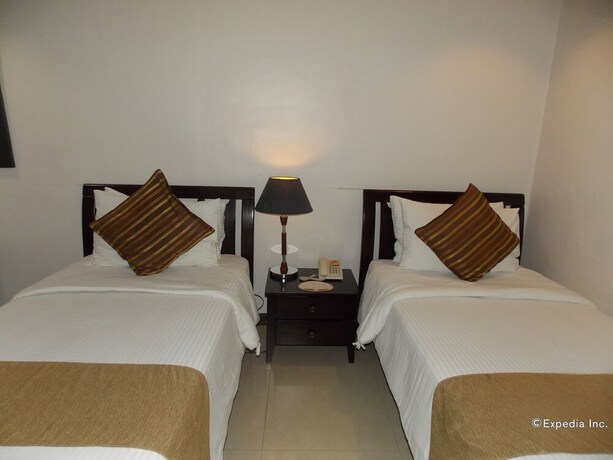 Imagen de la habitación del Hotel The Suites At Calle Nueva. Foto 30