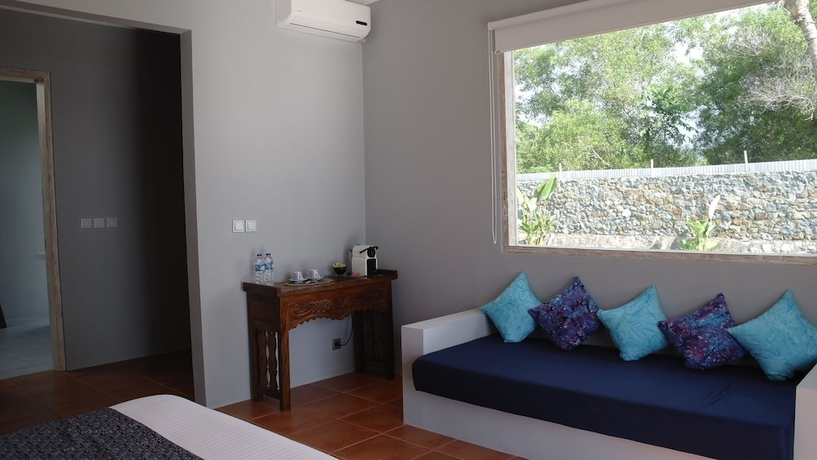Imagen de la habitación del Hotel The Suites Lombok. Foto 3