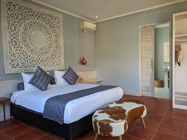 Imagen de la habitación del Hotel The Suites Lombok. Foto 4