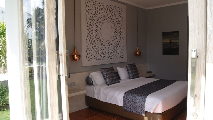 Imagen de la habitación del Hotel The Suites Lombok. Foto 11