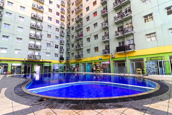 Imagen de la piscina del Hotel The Suites Metro by Hollypro. Foto 10