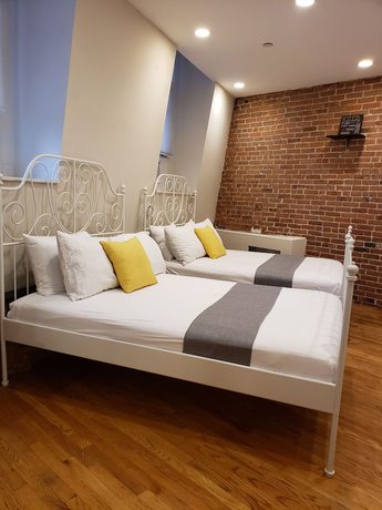 Imagen de la habitación del Hotel The Suites at central NYC. Foto 7