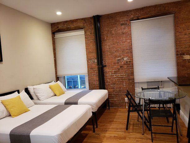 Imagen de la habitación del Hotel The Suites at central NYC. Foto 8