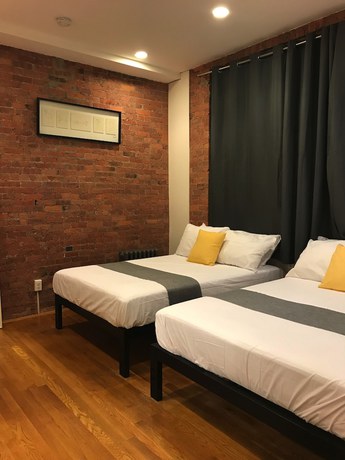 Imagen de la habitación del Hotel The Suites at central NYC. Foto 9