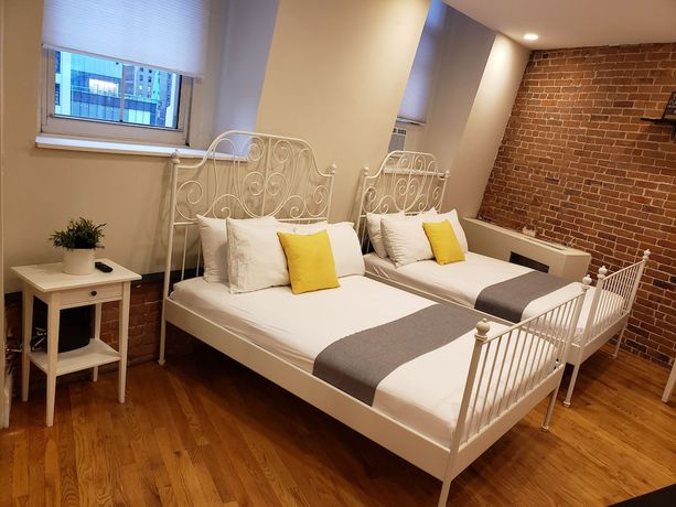 Imagen de la habitación del Hotel The Suites at central NYC. Foto 15