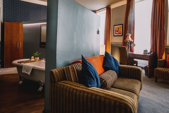 Imagen de la habitación del Hotel The Sun and Bar. Foto 12