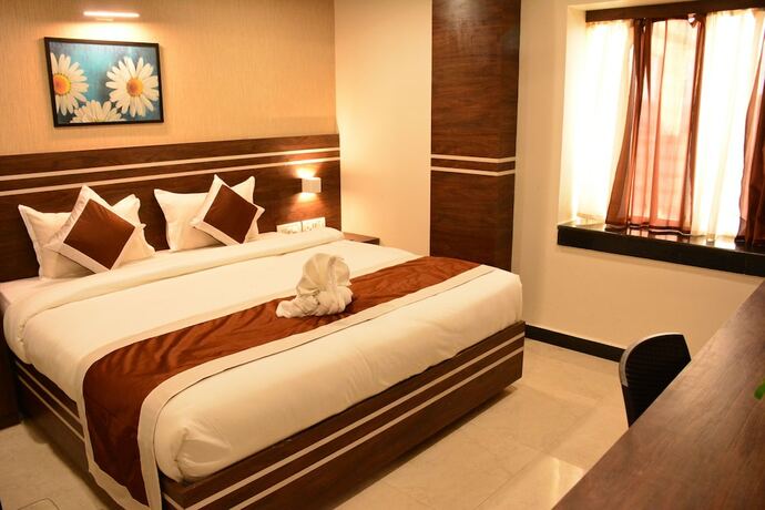 Imagen de la habitación del Hotel The Suncity. Foto 18