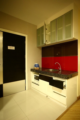Imagen de la habitación del Hotel The Sunreno. Foto 9