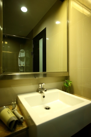 Imagen de la habitación del Hotel The Sunreno. Foto 11