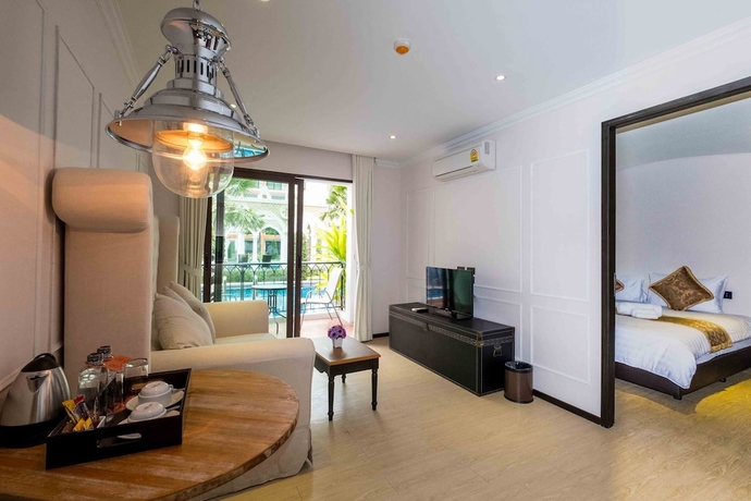 Imagen de la habitación del Hotel The Symphony Suites Pattaya. Foto 8