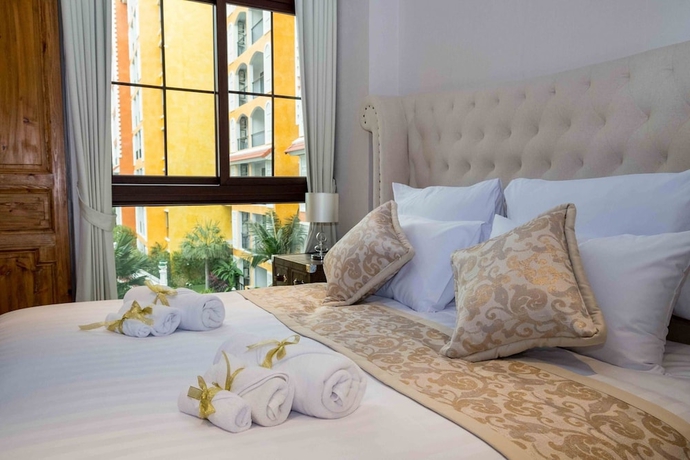 Imagen de la habitación del Hotel The Symphony Suites Pattaya. Foto 12