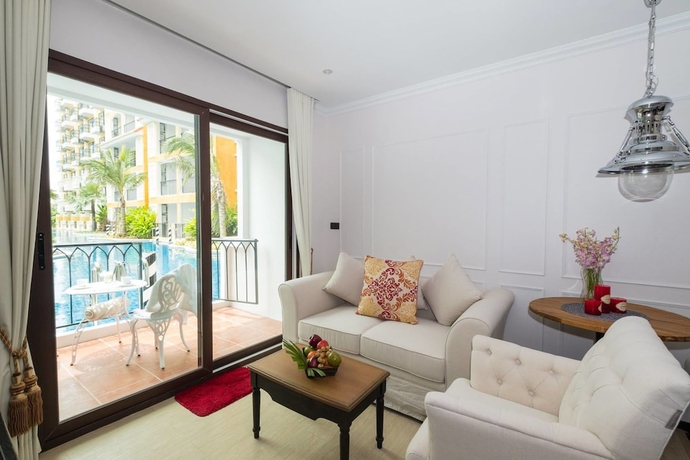 Imagen de la habitación del Hotel The Symphony Suites Pattaya. Foto 19