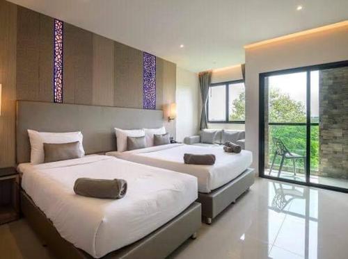 Imagen de la habitación del Hotel The TJ Jomtien. Foto 12