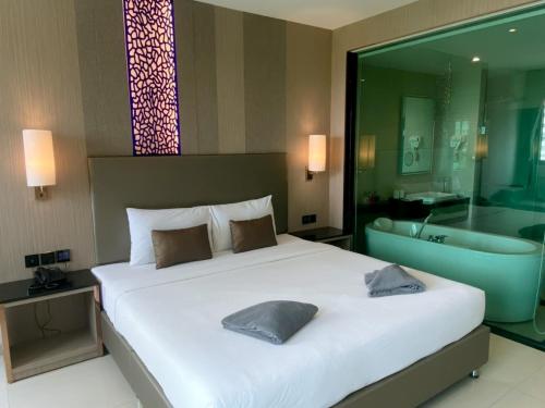 Imagen de la habitación del Hotel The TJ Jomtien. Foto 16