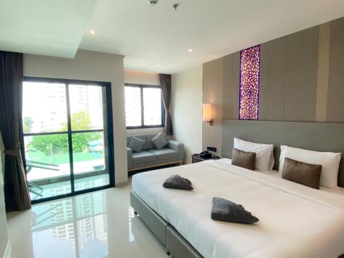 Imagen de la habitación del Hotel The TJ Jomtien. Foto 18