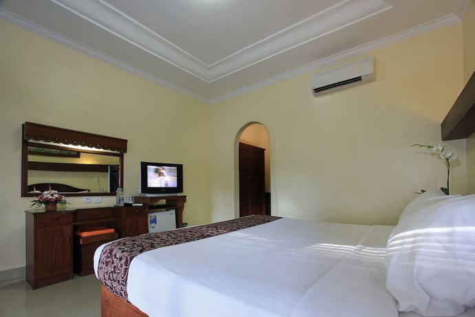 Imagen de la habitación del Hotel The Taman Ayu. Foto 4
