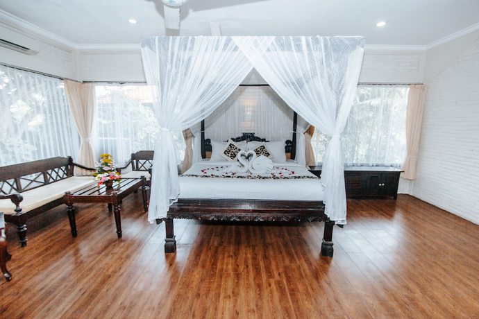 Imagen de la habitación del Hotel The Taman Ayu. Foto 7