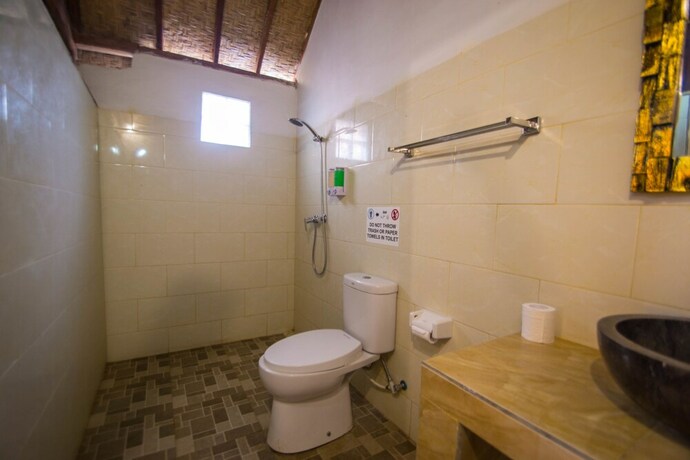 Imagen de la habitación del Hotel The Tandjung Cottage. Foto 25
