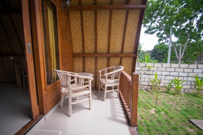 Imagen de la habitación del Hotel The Tandjung Cottage. Foto 29
