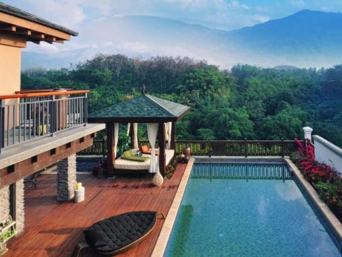 Imagen de la habitación del Hotel The Tang Hainan Mount Qixian. Foto 6