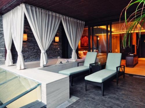 Imagen de la habitación del Hotel The Tang Hainan Mount Qixian. Foto 8