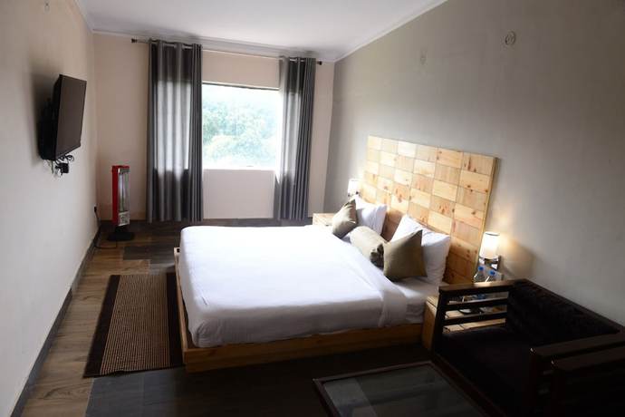 Imagen de la habitación del Hotel The Tattwaa Corbett Spa and Resort. Foto 5