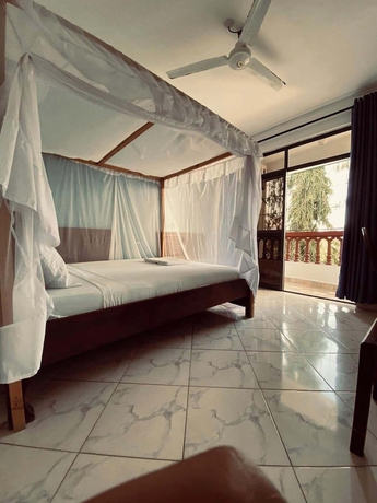 Imagen de la habitación del Hotel The Tavern Inn Shanzu. Foto 6