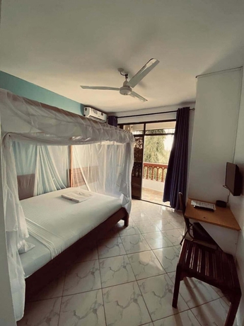 Imagen de la habitación del Hotel The Tavern Inn Shanzu. Foto 11
