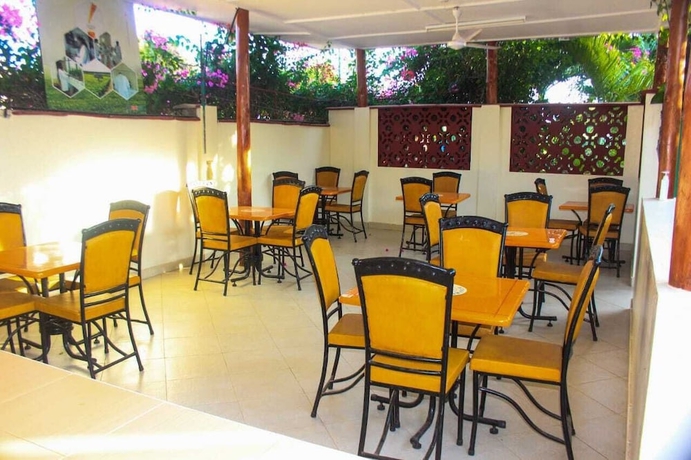 Imagen del bar/restaurante del Hotel The Tavern Inn Shanzu. Foto 4