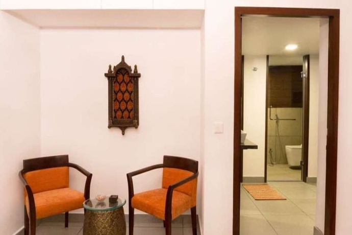 Imagen de la habitación del Hotel The Ten Suites. Foto 2