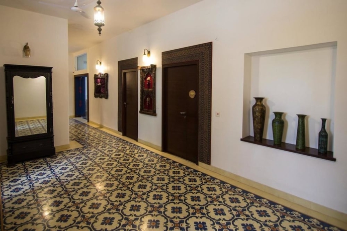 Imagen de la habitación del Hotel The Ten Suites. Foto 10