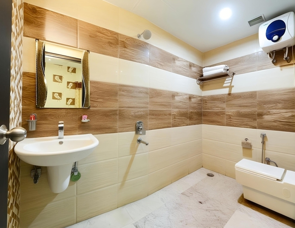Imagen de la habitación del Hotel The Tezo Residency. Foto 13