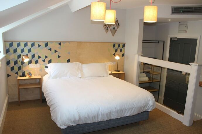 Imagen de la habitación del Hotel The Tilman. Foto 15