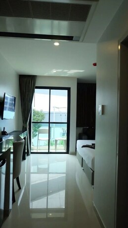 Imagen de la habitación del Hotel The Tj Resort. Foto 32