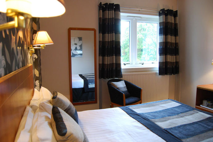 Imagen de la habitación del Hotel The Tontine. Foto 2