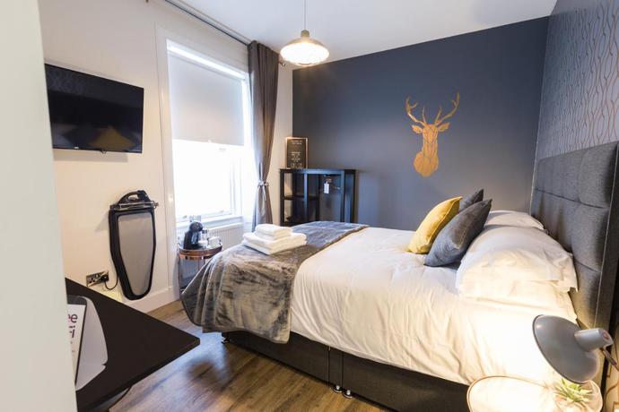 Imagen de la habitación del Hotel The Torfin. Foto 4