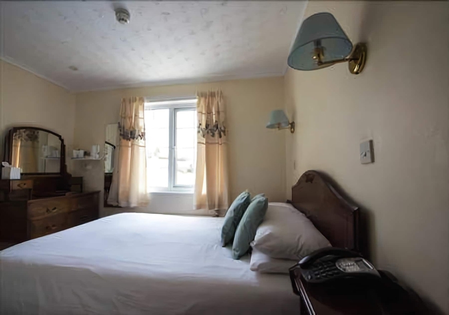 Imagen de la habitación del Hotel The Trengilly Wartha Inn. Foto 19