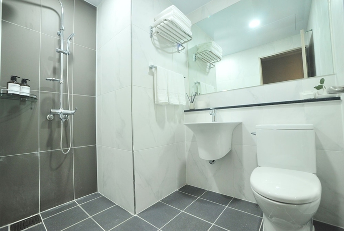 Imagen de la habitación del Hotel The Triny Urban Suites. Foto 5