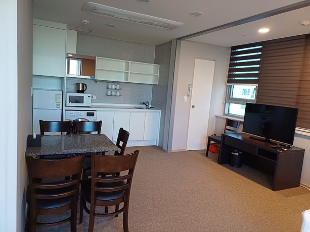 Imagen de la habitación del Hotel The Triny Urban Suites. Foto 8