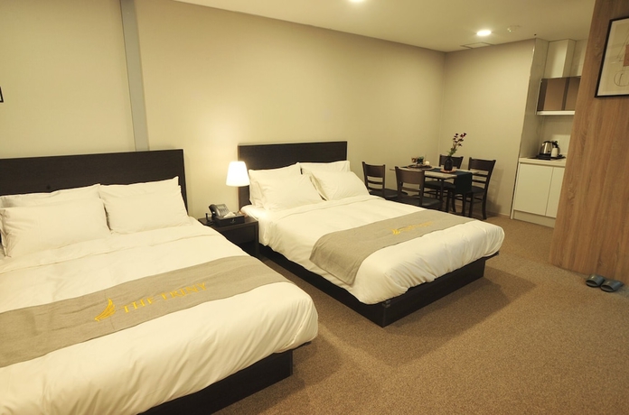 Imagen de la habitación del Hotel The Triny Urban Suites. Foto 10