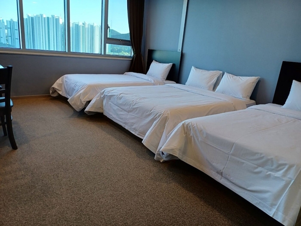 Imagen de la habitación del Hotel The Triny Urban Suites. Foto 13