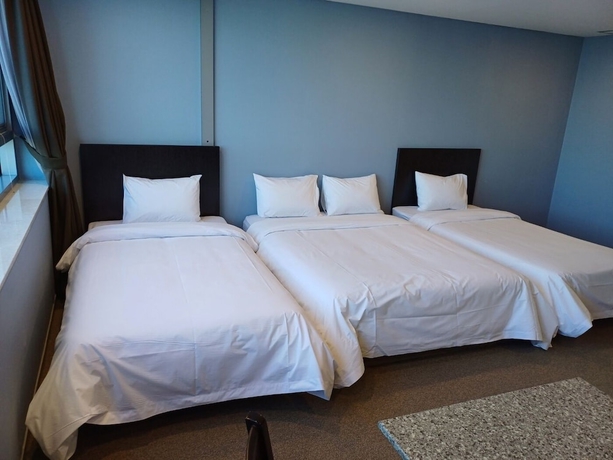 Imagen de la habitación del Hotel The Triny Urban Suites. Foto 14